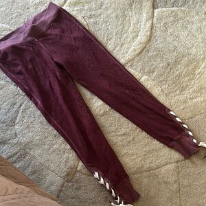 n:PHILANTHROPY Deep Red Leggings with Lace-Up Accent and back zipper pocket
